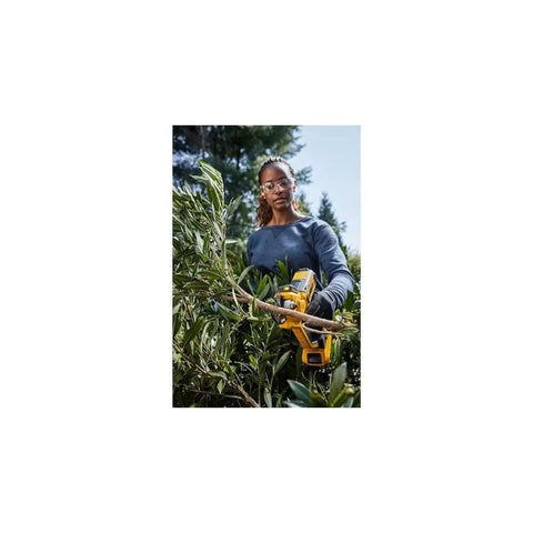 Person using 20V Max Cordless Pruner With 1-1/2 Inch Cut for trimming branches in a garden setting