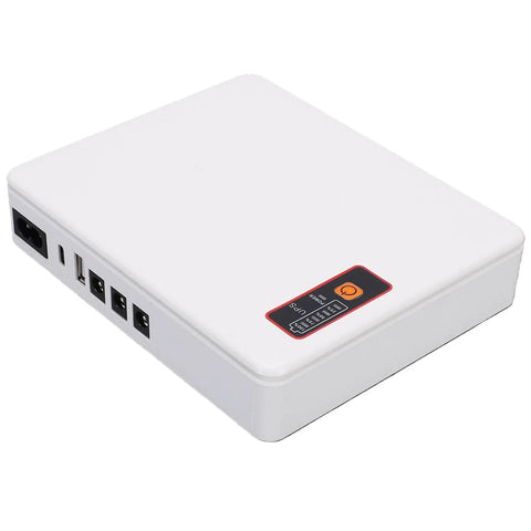 Compact Mini Ups Battery Backup For Home Routers Modems Offering 12000Mah Capacity And 18W Clean Output To Keep Your Internet Flowing Smooth Through Grid Drops With Trustworthy Us Plug Adapter For No Sweat Streaming And Work Calls, white exterior with multiple ports