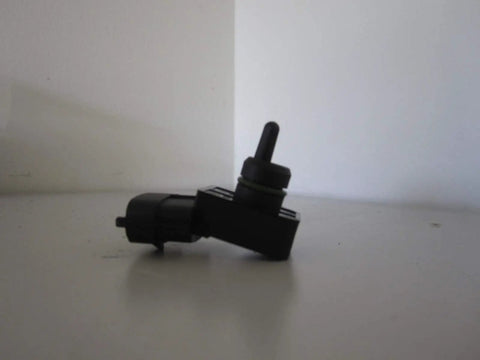 Hyundai MAP Sensor Assembly 39300-2B100 Black OEM Quality Direct Fit For Your Ride, Clean Drop-In Replacement That Keeps Your Engine Running Smooth With Accurate Readings And Real-Deal Reliability black plastic sensor side view