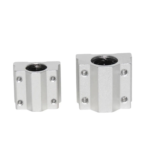4 Pack SC6UU Linear Motion Ball Bearing Slide Block Bushings For CNC Router Builds showing two silver bushings with holes.