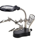 Desktop LED Magnifying Glass Soldering Station With Dual 3.5X And 12X Magnification Ideal For PCB Repairs Jewelry Cleaning And Hobby Crafts Bright Lighting And Sturdy Alligator Clips, featuring a adjustable metal arms and a weighted base.