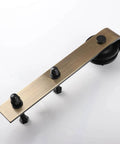 Brushed Gold Barn Door Hardware Kit For Interior Doors Heavy-Duty Carbon Steel Sliding Roller Set With Classic J Rail 200 Pounds Capacity Fits Doors 1.38 To 1.57 Inches Thick Includes 2 Rollers 2 Stoppers 2 Anti Jump Pads And 1 Floor Guide