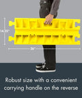 Person holding a yellow Drive-Over Cable Protector One Channel With Drop-In Design For 2.25 Inch Lines, 14.25 x 36 inches