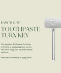 Side view of a chrome toothpaste turn-key metal tube squeezer with long handle