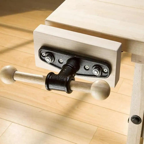 Close-up of 7 Inch Woodworking Vise For Workbench Front Vise Cast Aluminum Front Screw Vise mounted on wooden bench corner