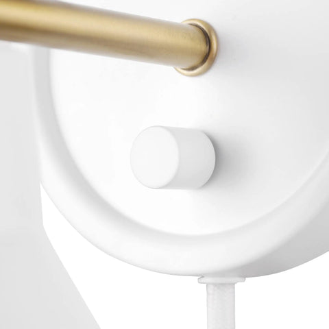 Close-up of Dope Lofty Chic Modern Matte White Wall Sconce With Brass Accent showing rotary switch detail.