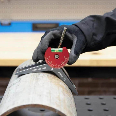 Strong Hand Tools MPCH250 magnetic pipe centering head with red dial on a pipe, gloved hand.