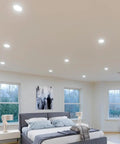 Bedroom with 12 Pack 4 Inch Ultra Thin Recessed Led Downlights With 5 Color Temperature Selectable 2700K Through 5000K 750 Lumens Per Light Slim Canless IC Rated Dimmable Ceiling Light With J Box, illuminating the space elegantly.