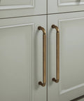 Six Pack Antique Brass Zinc Alloy Cabinet Pulls With 5 Inch Hole Center 5.5 Inch Total Length 128mm Center To Center Kitchen Drawer Handles Includes M4 Screws Model 2201 GT 128 Durable Finish For Everyday Use installed on cabinets