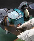 Heavy Duty 250 Watt Bench Grinder Featuring Dual Illuminated Work Lights And Rock Solid Base For Smooth Metal Grinding And Fast Tool Restoration In Any Home Garage Setup, with sparks flying while sharpening metal.