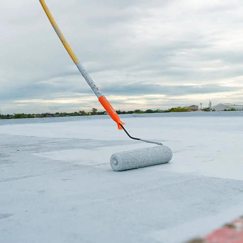 Heavy Duty Liquid Waterproofing Membrane Multi Surface Crack And Leak Repair Coating Interior Exterior Water Based Moisture Blocker Heavy Duty Sealant Easy Brush Application 5 Gallon Sandy Beige being applied with a roller on a roof.