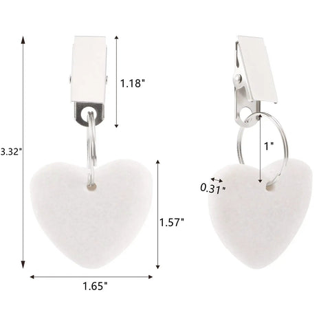 Close-up of white heart-shaped stone tablecloth weights with metal clips. 12 Pieces White Heart Shaped Stone Tablecloth Weights With Metal Clips For Indoor Outdoor Use Keeps Table Covers Flat At Picnics And Hangouts Durable Marble Feel Decor.