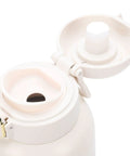 Top Shelf Portable Milk Warmer With Hella Quick 50W Heating Cordless Rechargeable Baby Bottle Heater Featuring Smart Constant Temperature Control For Travel And Outdoor Adventures open lid showing easy pour spout