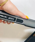 Close-up of Extreme Nano Titanium Hair Straightener With Floating Plates, Fast Heating, held in hand