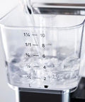 Water being poured into the 1.25L capacity of the Stainless Steel Drip Coffee Maker With Thermal Base Keeps Your Brew Hot For Hours 1.25L Capacity Analog Hand Brewed And Automatic Filter Coffee Machine For Home Or Office Use.