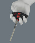 Hand holding screwdriver from Advent Calendar 2025 For Tool Nerds And Gearheads 28 Piece Screwdriving Kit Featuring 18 Screw Profiles And Two Versatile Storage Racks