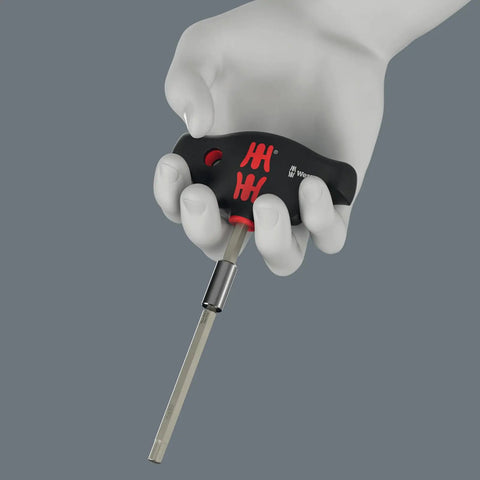 Hand holding screwdriver from Advent Calendar 2025 For Tool Nerds And Gearheads 28 Piece Screwdriving Kit Featuring 18 Screw Profiles And Two Versatile Storage Racks