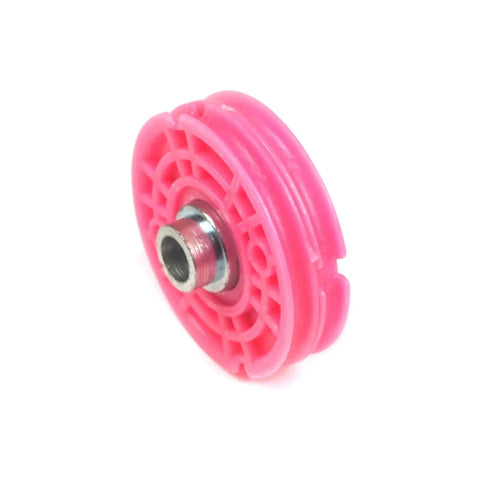 Close-up of pink injection molded pulley in Built Tough Window Regulator Repair Cord Kit for BMW E39 1996-2004.
