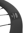 Close-up of Aero Carbon Wheel Set With Center Lock Disc Hubs, 45mm Deep Clincher, 25mm Width, UD Matte Carbon Weave rim.