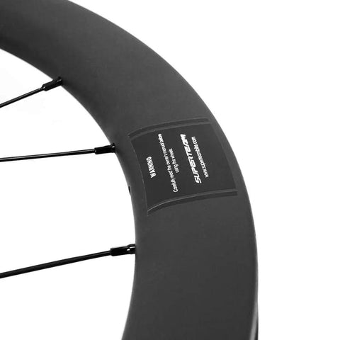 Close-up of Aero Carbon Wheel Set With Center Lock Disc Hubs, 45mm Deep Clincher, 25mm Width, UD Matte Carbon Weave rim.