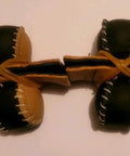 Durable Leather Spur Protectors for Chickens Set of 4 with Flexible Rubber Bands shown in brown and black
