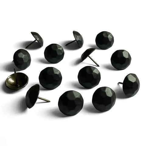 Sixty Piece Bundle Of Hella Sturdy Matte Black Upholstery Tacks Featuring A Slick One Inch Round Head Built For Sofas And Headboards A Top Shelf Boost For Furniture Flips No Fuss Installation Everyday - close-up of matte black upholstery tacks.