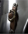 Close-up of brown leather straps on Imperial Faulds And Tassets Set For LARP And Cosplay Built For Beefy Medieval Steel Leg Armor