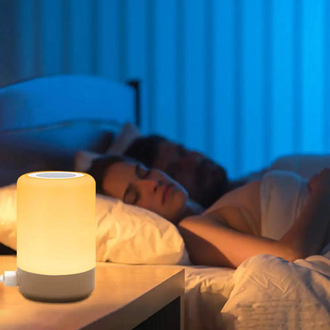 Touch Night Light Table Lamp With 4 USB Ports, Dimmable Warm White and 13 RGB Colors in bedroom setting with sleeping couple