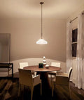 Dining room with Swanky 15 Inch One Light Pendant in Satin Etched Glass with Brushed Nickel Finish over table