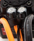 Close-up of Firma 85A Brushless Smart ESC And 3300Kv Sensorless Motor Combo's wiring and capacitors, SPMXSEMC01 black housing