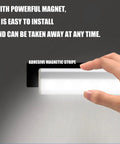 Hand installing 6 Pack LED Motion Sensor Closet Lights With 10 LED Battery Operated Stick On Magnetic Night Light Bar on wall