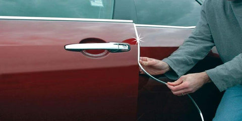 Chrome U-channel edge guard trim for car doors; 18 ft rubber bumper protector being installed on a maroon sedan door.