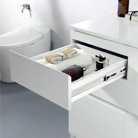 Open drawer showing 22 Inch Ball Bearing Drawer Slides Soft Close Full Extension Heavy Duty With Brackets Side Or Rear Mount Zinc Plated Steel 78 Lb Load Capacity 10 Pairs For Kitchen Cabinets Furniture And Tool Chests Smooth Quiet Glide installed in a white cabinet, exposing towels and toiletries.