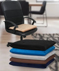 Stack of square 18x18 inch memory foam chair cushions in black, blue, gray, and brown, with one cushion on an office chair in a room.