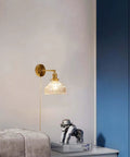 Wall Sconce Lights Indoor Bedroom Hallway Vintage Glass with Pull Chain,Industrial Adjustable Fixture,Brass Lamp for Living Room,E27 Base mounted beside a bed.