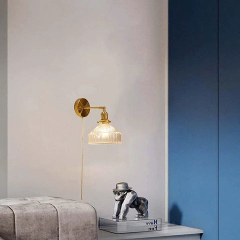 Wall Sconce Lights Indoor Bedroom Hallway Vintage Glass with Pull Chain,Industrial Adjustable Fixture,Brass Lamp for Living Room,E27 Base mounted beside a bed.