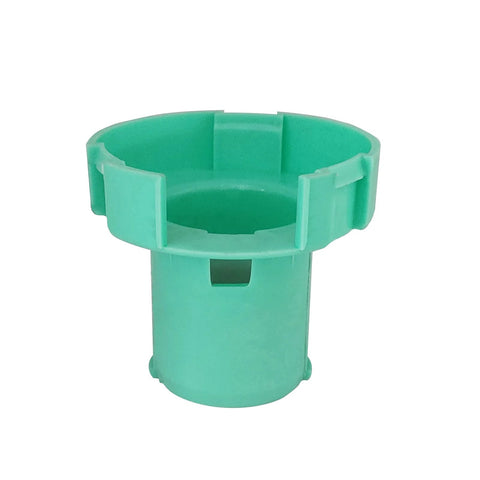 Front view of green plastic steering shaft bearing housing for GM trucks