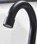 Close-up of Matte Black Bathroom Sink Faucet With Widespread 8 Inch 3 Hole Vanity Fit, 360 Degree Swivel Spout.