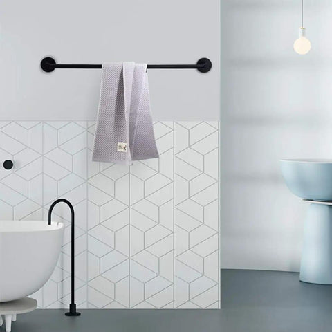 Slick Black Bathroom Hardware Set Wall Mounted 24 Inch Towel Bar with towel in modern bathroom setting