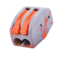 Close-up of a Straight Up Quick Install Terminal Block Wire Connector featuring orange push levers for easy wiring.