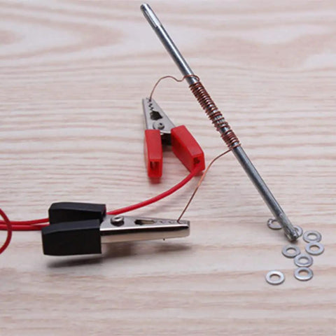 Homemade Electromagnet Do It Yourself Kit For Physics Experiments And Science Projects including wire-wrapped nail and clips.