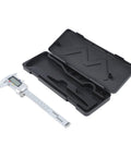Digital Vernier Caliper with Large LCD Display lying next to its black plastic case, showing stainless steel design and measurement scale.