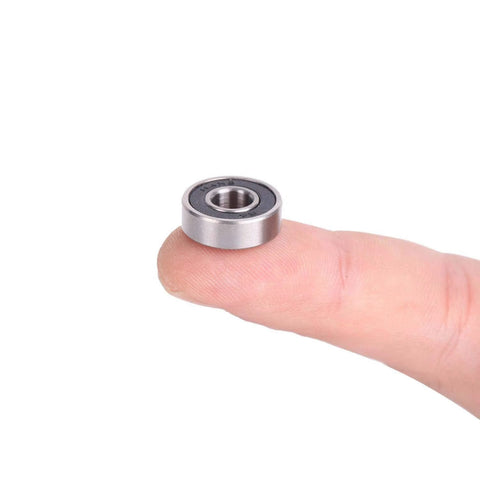 Donepart R4-2RS ball bearing, 1/4 x 5/8 x 0.196 in, double-sealed metal bearing held on fingertip
