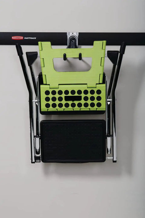 FastTrack Rail Garage Organization System With Multi-Purpose Hooks And 50 Lb Capacity Satin Nickel Wall Mounted showing green step stool.