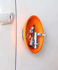 Orange magnetic bowl holding screws and bolts attached to a metal surface, part of Magnetic Parts Tray Set With Two Magnetic Bowls And Telescopic Magnetic Pick Up Tool For Easy Garage Organization Holds Nuts And Bolts And Small Parts Reaches Up To 25.3 Inches Keeps Your Tools Neat And Ready.