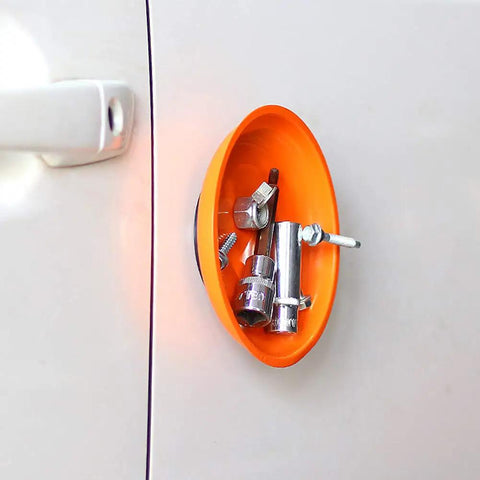 Orange magnetic bowl holding screws and bolts attached to a metal surface, part of Magnetic Parts Tray Set With Two Magnetic Bowls And Telescopic Magnetic Pick Up Tool For Easy Garage Organization Holds Nuts And Bolts And Small Parts Reaches Up To 25.3 Inches Keeps Your Tools Neat And Ready.