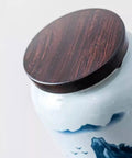 Top Shelf Airtight Ceramic Tea Canister Keeping Freshness Locked Inside Retro Blue And White Landscape Vibes Large Pantry Storage Jar For Coffee Beans lid view with wooden top