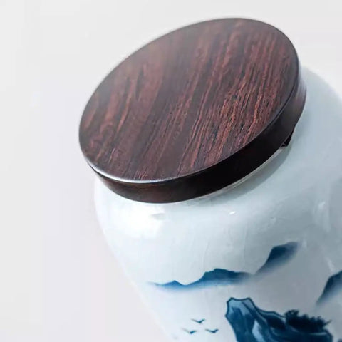 Top Shelf Airtight Ceramic Tea Canister Keeping Freshness Locked Inside Retro Blue And White Landscape Vibes Large Pantry Storage Jar For Coffee Beans lid view with wooden top