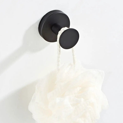 Heavy Duty Black Stainless Steel Wall Hook with white loofah hanging, perfect for organizing jackets and gear in your home.