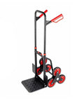 Stair Climbing Hand Truck For Movers Portable Folding Cart Built With Sturdy Metal Frame Perforated Loading Base And Burgundy Handle Grips For Easy Stair Hauling And Heavy Lifting On The Job. Black metal six-wheel stair-climbing hand truck with perforated base.